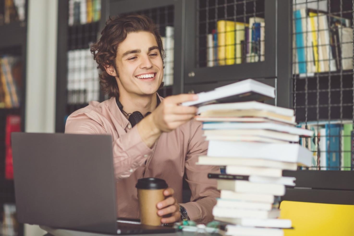 Business owner reviewing financial documents with calculator and charts